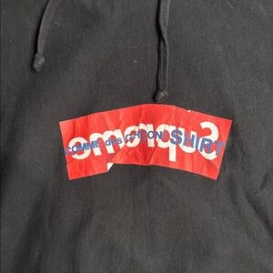 COMME des GARÇONS Homme Plus Black Hoodie with Red Logo
